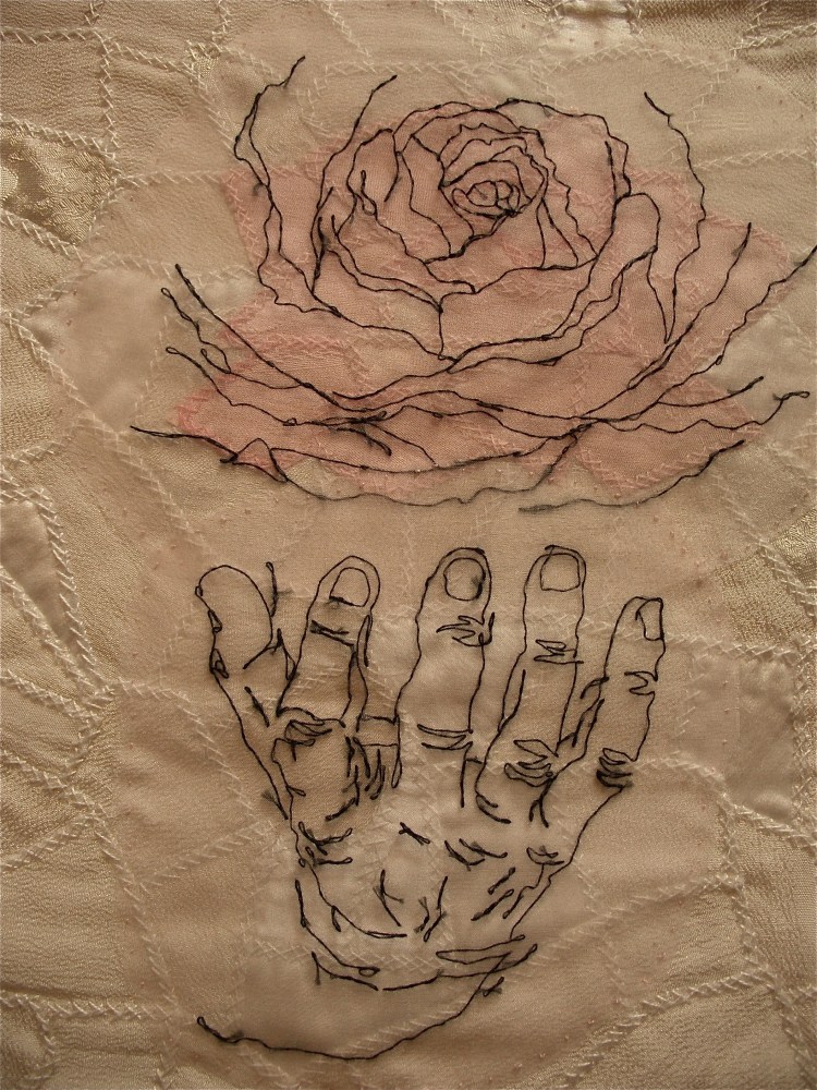 Sumi deconstructed the kimonos and added silk organza to hand-stitch a patchwork that she then embroidered with unsketched roses and hands.